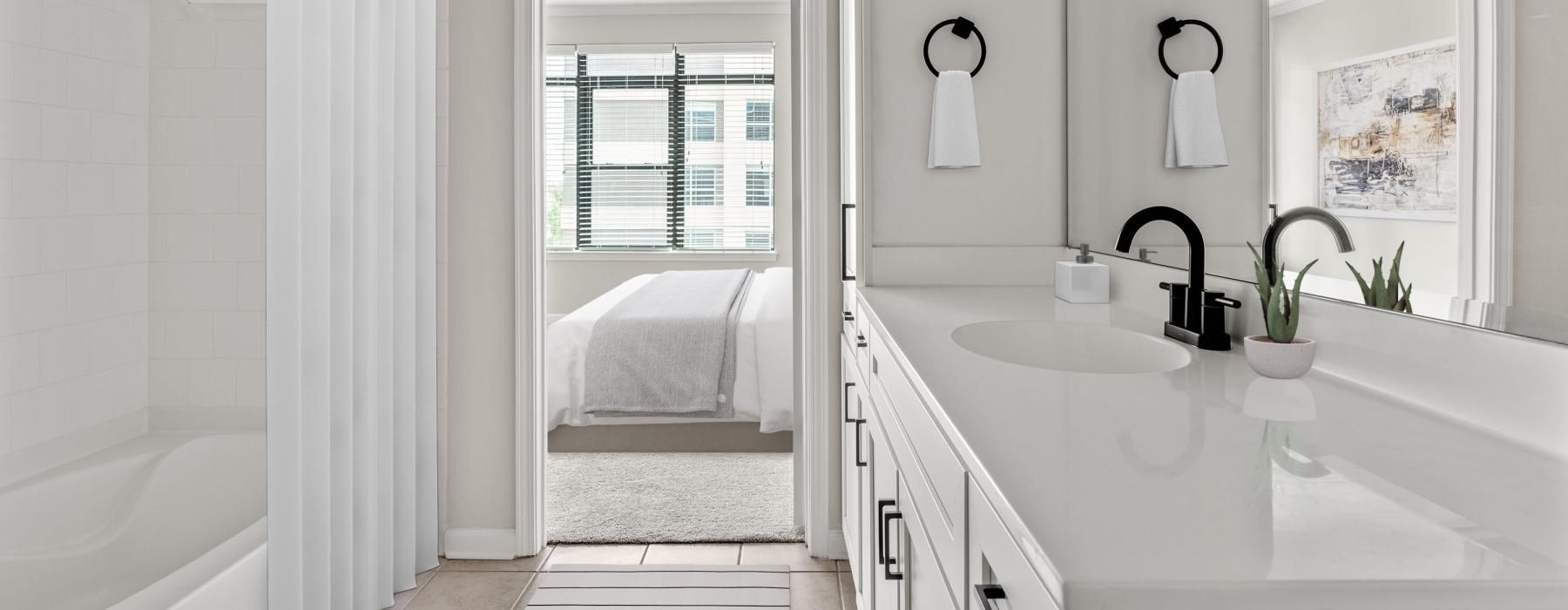 a bathroom with a tub sink and a bathtub