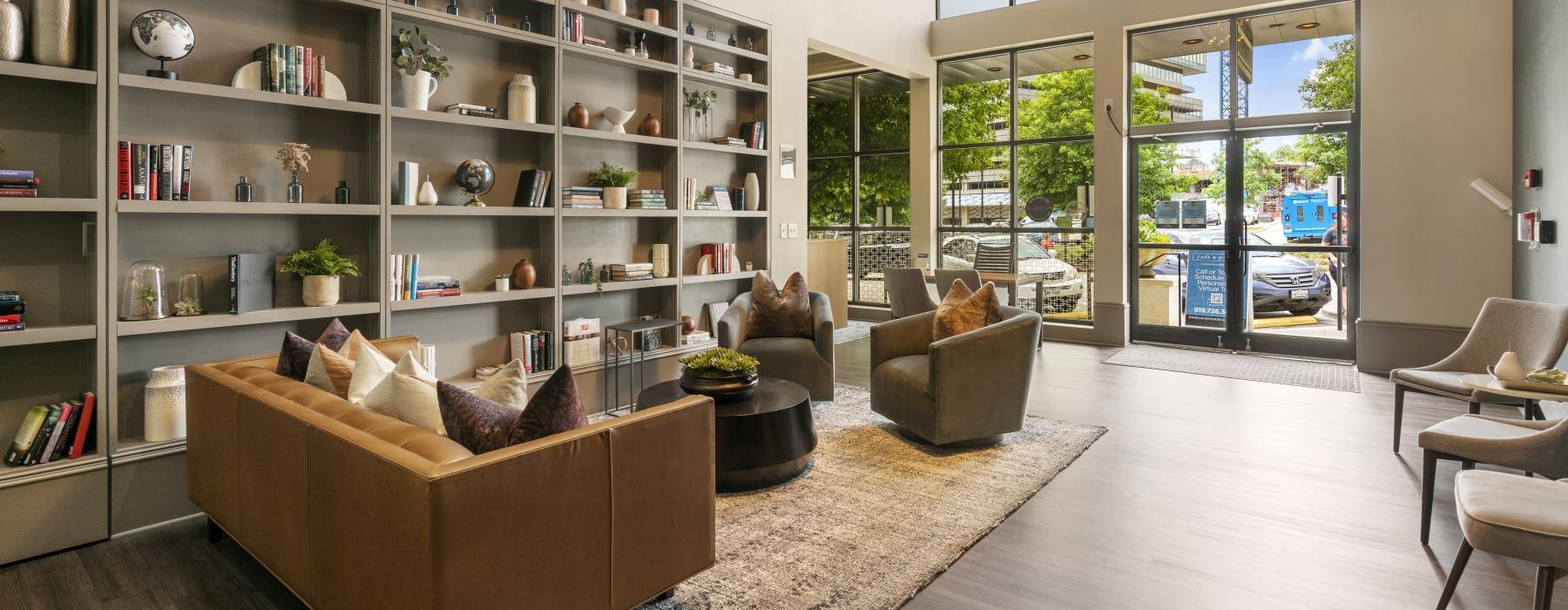 a room with a large bookcase and a couch