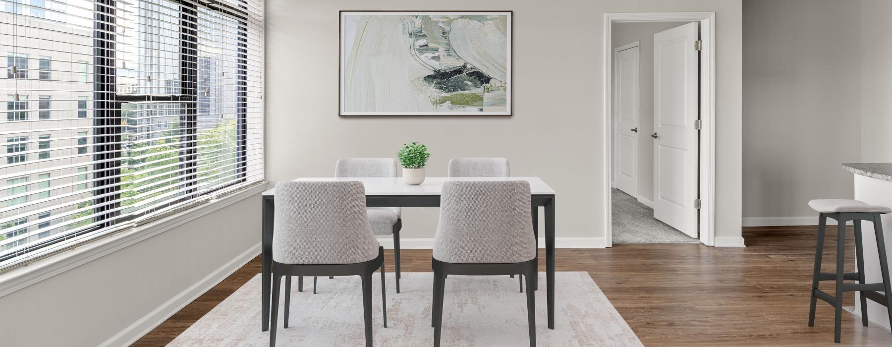 a dining room with a table and chairs