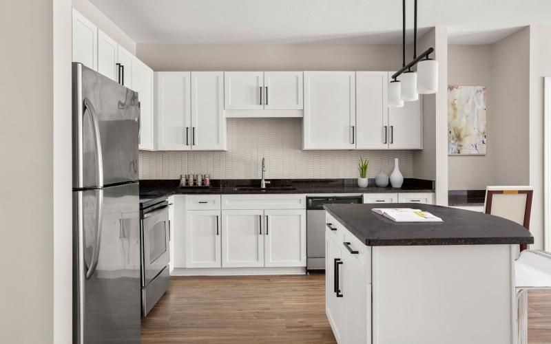 a kitchen with white cabinets